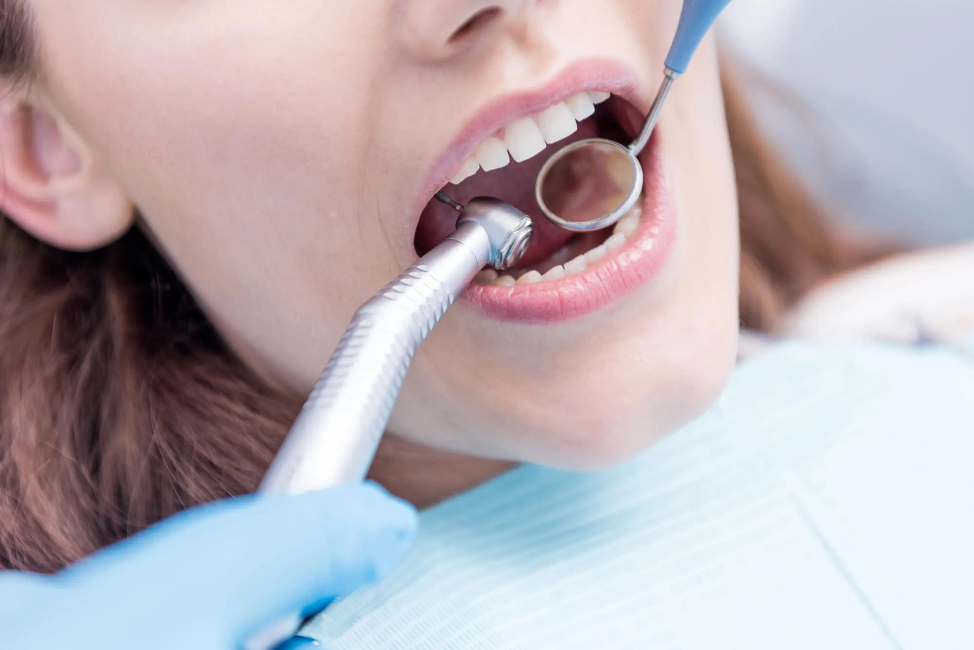 Denville Dentist examines teeth