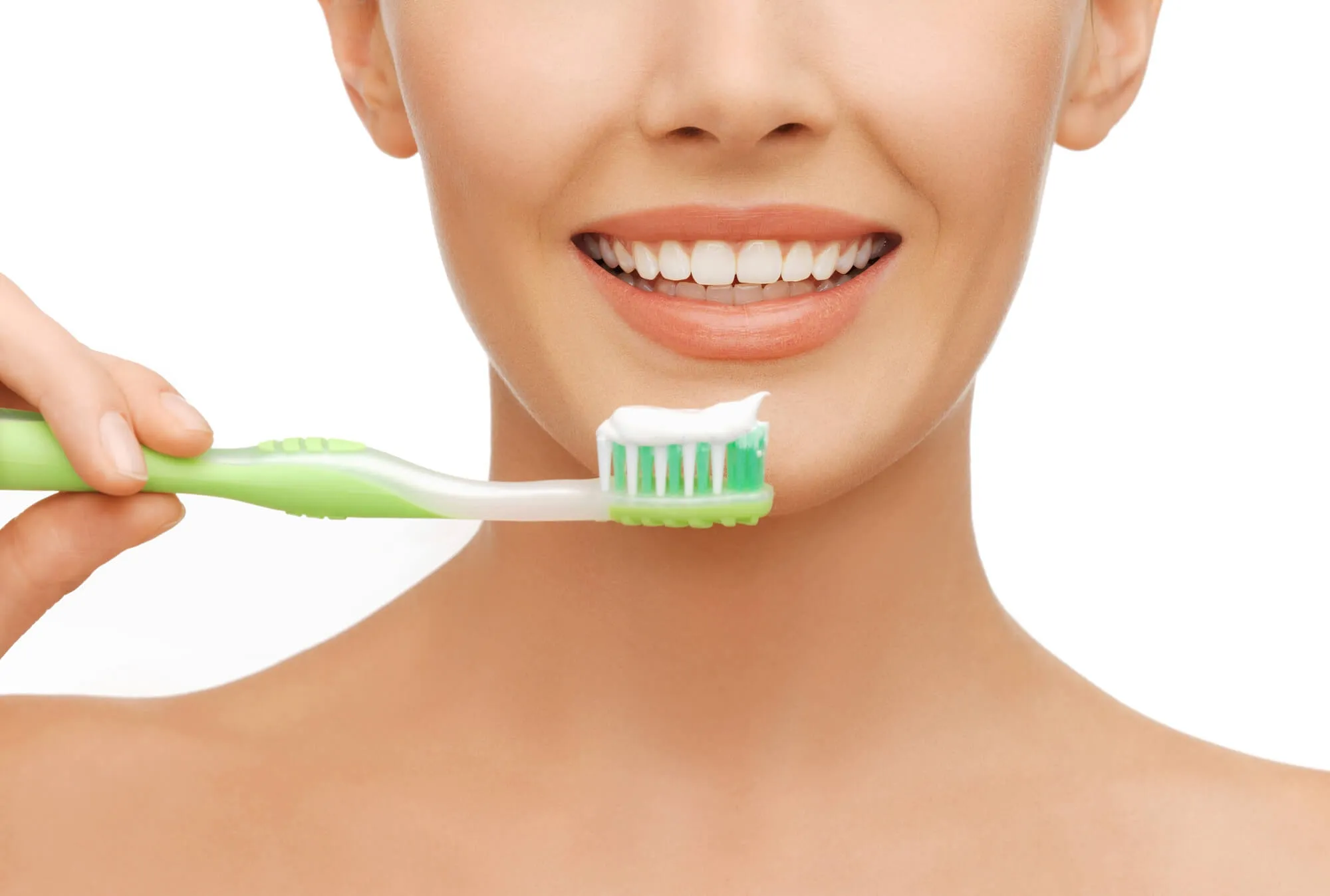 woman brushing as advised by her Denville Dentist